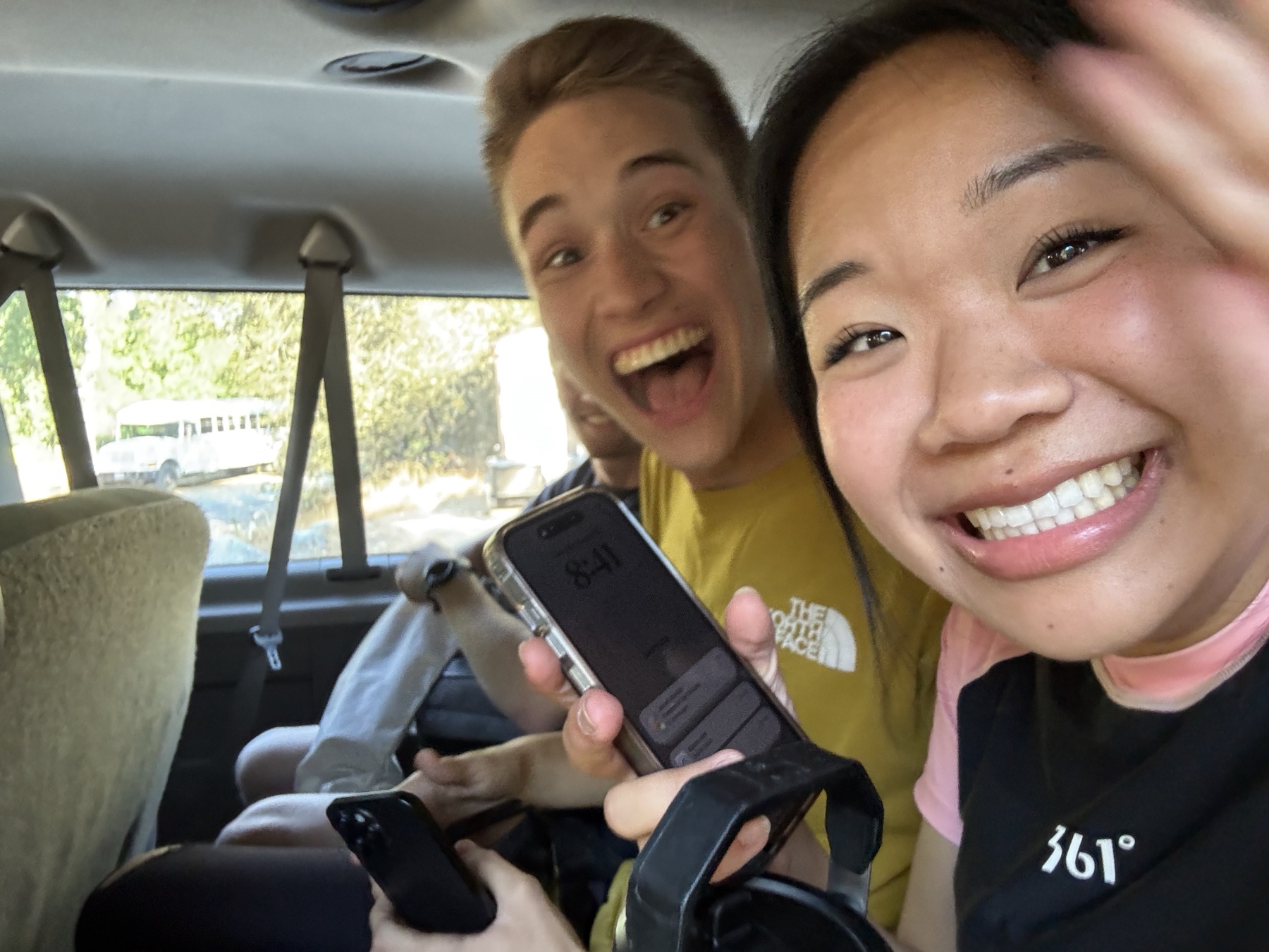 Tiffany and Josiah laughing together during a car ride
